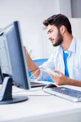 Fototapeta premium IT technician looking at IT equipment