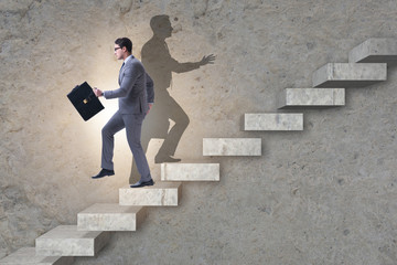 Businessman and his shadow in business concept