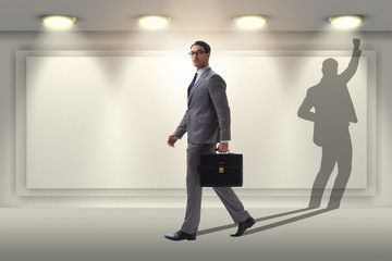 Businessman and his shadow in business concept