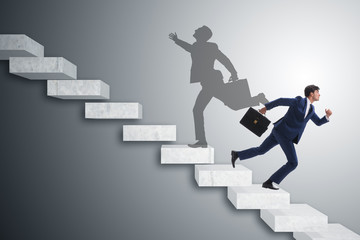 Businessman and his shadow in business concept
