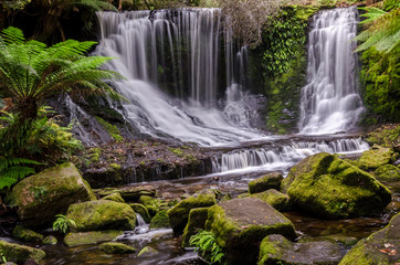 Horseshoe Falls lies within Tasmania, Australia. It is situated in lush, green rainforest. Long exposure with moss covered rocks in the foreground.
