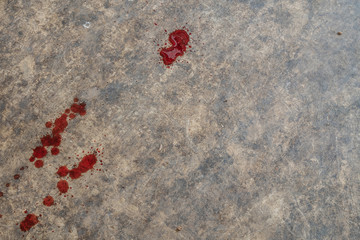 Blood on cement floor.