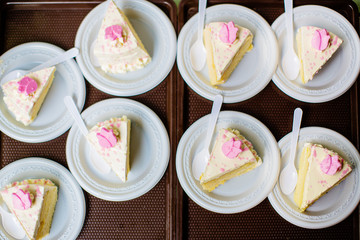 Many pieces of white cake and decorate by pink chocolate heart shape in buffet line. sweets and dessert bakery. valentine sweety concept. image for background, wallpaper, copy space and decoration.