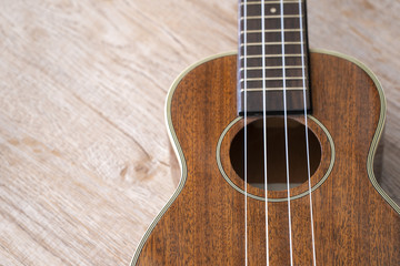 Fototapeta premium Ukulele on a wooden floor // still life