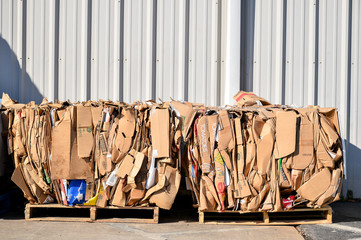 cardboard bundled and tied on pallets for recycling