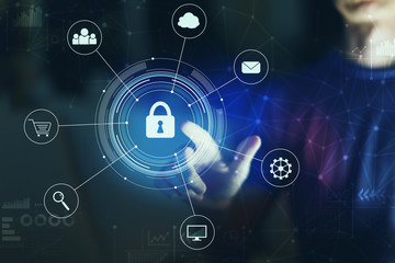 Cyber security with young man pointing on a dark background