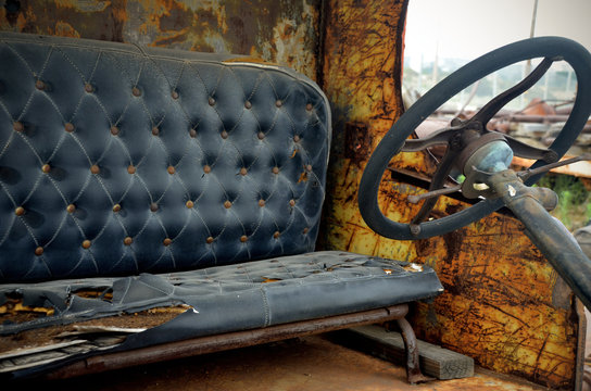 Drivers seat and steering wheel in old truck