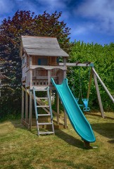 child's playhouse with ladder and slide