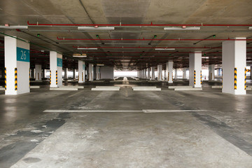 Empty space car park interior at afternoon.Indoor parking lot.interior of parking garage with car and vacant parking lot in parking building.some carpark empty in Condominium or department store.