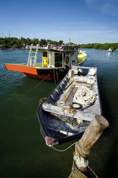 Fototapeta beautiful village in Terengganu, Malaysia with background of traditional fisherman boat moored