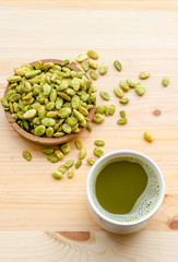 Organic Green Matcha Tea and edible seeds of hyacinth bean snack