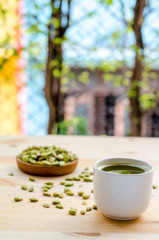 Organic Green Matcha Tea and edible seeds of hyacinth bean snack