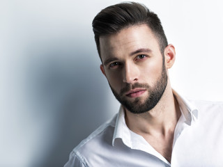 Handsome man in white shirt. Closeup portrait.