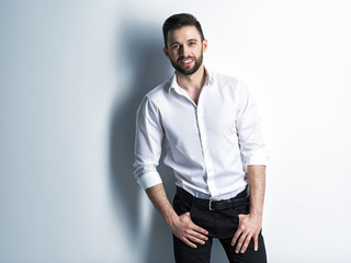 Handsome man with a smile in white shirt