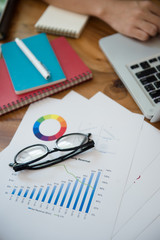 Business male hands typing on a laptop keyboard on desk with a cup of coffee in evening light,Urgent agenda,Freelance work at home office.