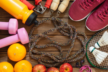 Fitness and healthy active lifestyle dieting background concept. Dumbbell, jump ropes, apples,...