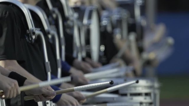 Drummers from marching band in slow motion