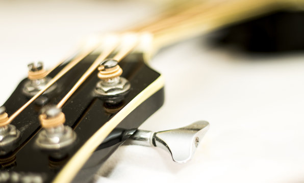 Acoustic bass guitar isolated on the white background