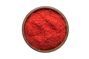 chili pepper powder spice in wooden bowl, isolated on white background. Seasoning top view