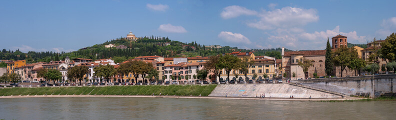 Panorama of the Adige River overlooking the Sanctuary of the Madonna of Lourdes. Verona, Italy. The sanctuary is located on a hill. On the right is the church of Santo Stefano