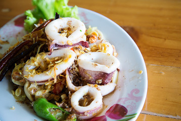 Fried squid with shrimp cream paste, local food thai style. recommended menu for tourist and traveler. image for background, objects,article and menu list.