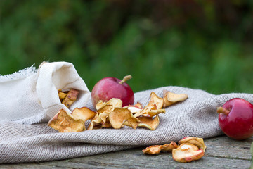 Apples on wooden background.Dried fruits from apples.