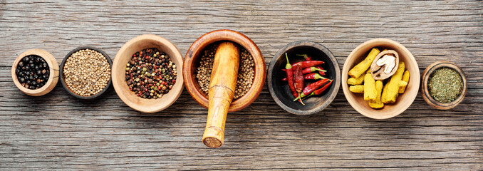 Different spices in bowls on table