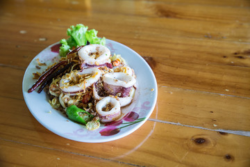 Fried squid with shrimp cream paste, local food thai style. recommended menu for tourist and traveler. image for background, objects,article and menu list.