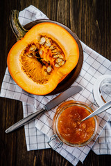 Pumpkin with jam on wooden background