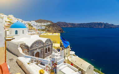 Oia, Santorini - Greece. Famous attraction of white village with cobbled streets, Greek Cyclades...