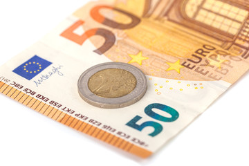 Stack of Euro banknotes and coins isolated. 50 Euro banknot