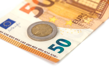 Stack of Euro banknotes and coins isolated. 50 Euro banknot