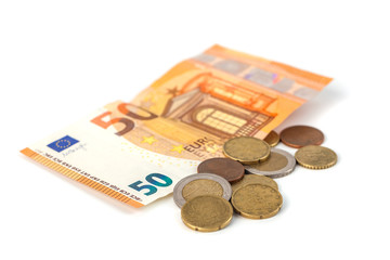 Stack of Euro banknotes and coins isolated. 50 Euro banknot