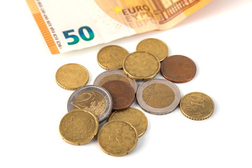 Stack of Euro banknotes and coins isolated. 50 Euro banknot