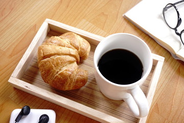 Croissant with coffee as a coffee break