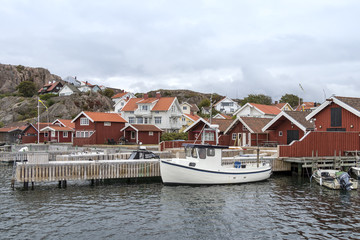 Old buildings and boats at the skerry coast near Bovallastrand (Sweden)