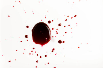 Drops of blood isolated in white.