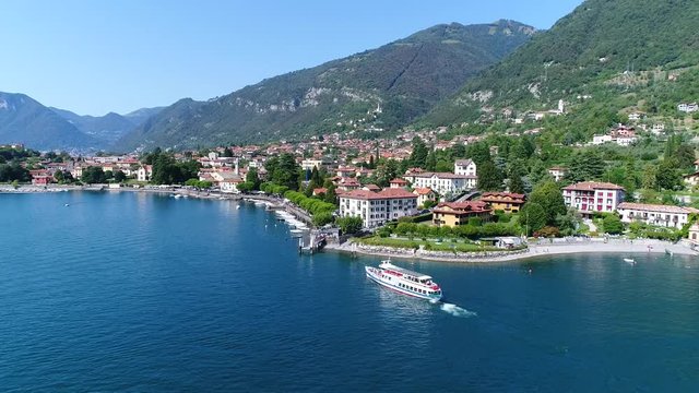 Village of Lenno on Como lake and ferryboat. Holidays in Italy