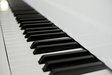 Naklejka premium Close up piano keys black and white keys. perspective from piano keyboard. classic musical instrument. romantic sound origins. unplugged music device. image for background,wallpaper,objects,copy space