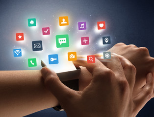 Naked female hand with smartwatch and  application labels around and dark background