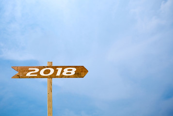 Sign banner 2018 Isolated blue sky background.Wooden sign isolated on sky.
