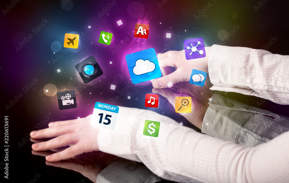 Poster Male hands touching interactive table with colorful application icons on it 