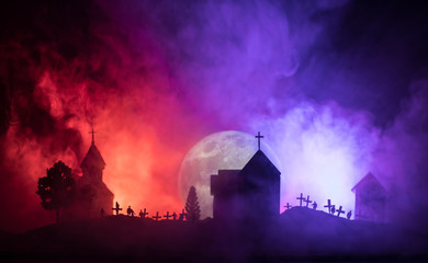 Naklejka na ściany i meble Scary view of zombies at cemetery dead tree, moon, church and spooky cloudy sky with fog, Horror Halloween concept.