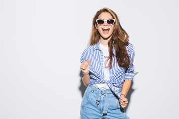 Fototapeta premium Pretty young sexy fashion sensual woman posing on white wall background