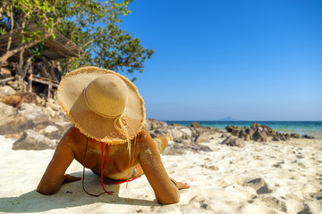 Fototapeta na wymiar woman resting at the tropical beach resort