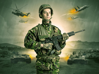 Armed soldier with sniper in the middle of a war
