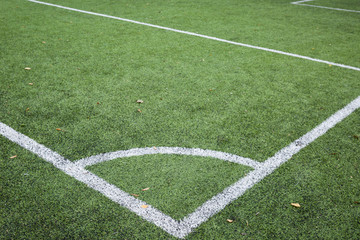 Obraz premium Closeup of Corner kick line of football and soccer field, background texture