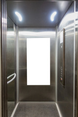 Mock up. Vertical poster media template frame hanging on the wall in elevator lift © vejaa