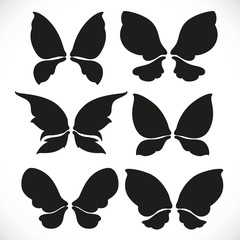 Fototapeta na wymiar Black silhouette of fairy wings different form for cutting set 2 isolated on a white background