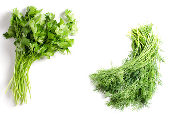 Bunch of dill and a bunch of parsley on a white background. Space for text